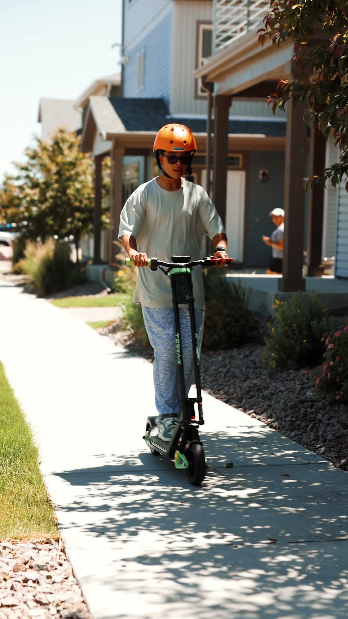 Seated e-scooter on a neighborhood sidewalk